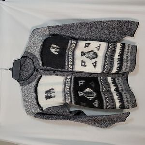 Black, gray and white sweater.